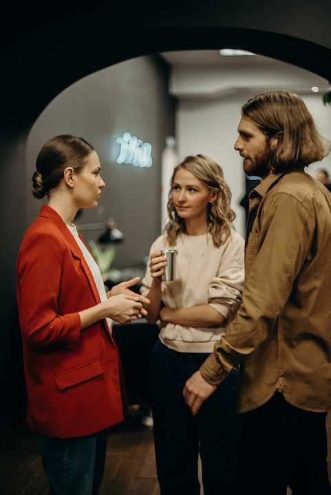 People Talking in Well-lit Room